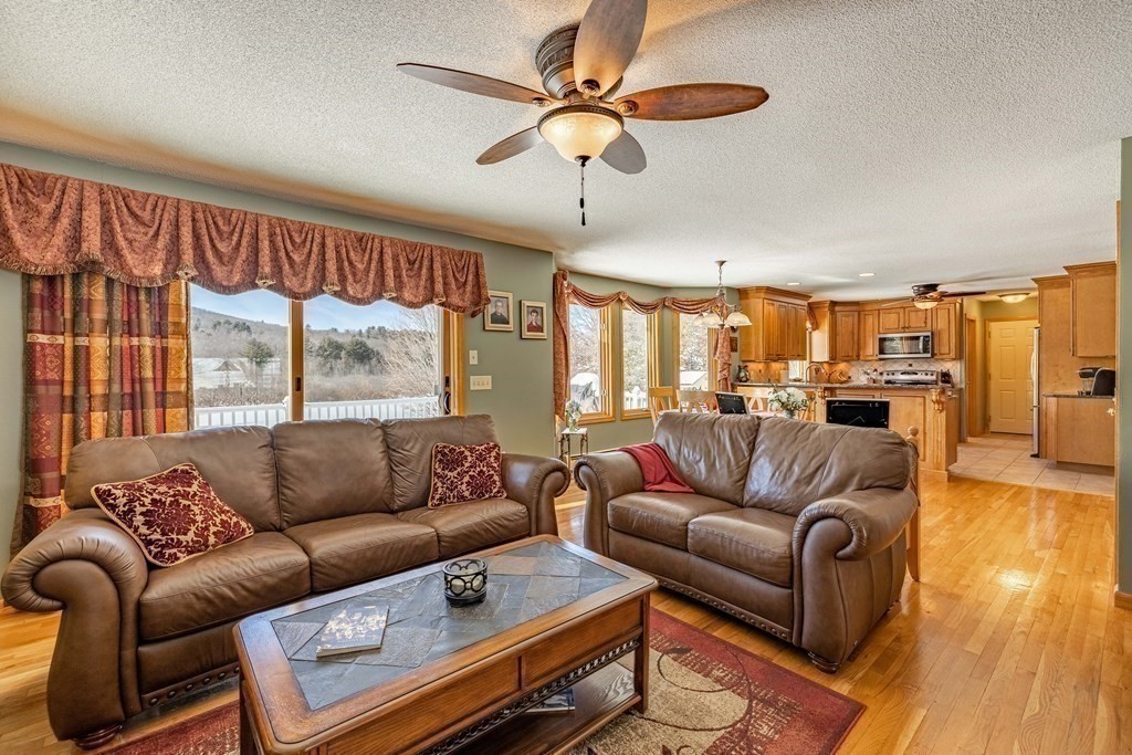 158 Scantic Road Hampden, MA 01036 - Photo 12 of 42 a living room with furniture and a large window