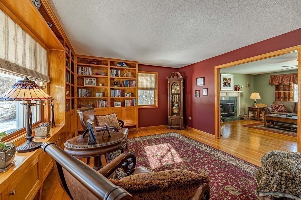 158 Scantic Road Hampden, MA 01036 - Photo 14 of 42 a living room with furniture stove and wooden floor