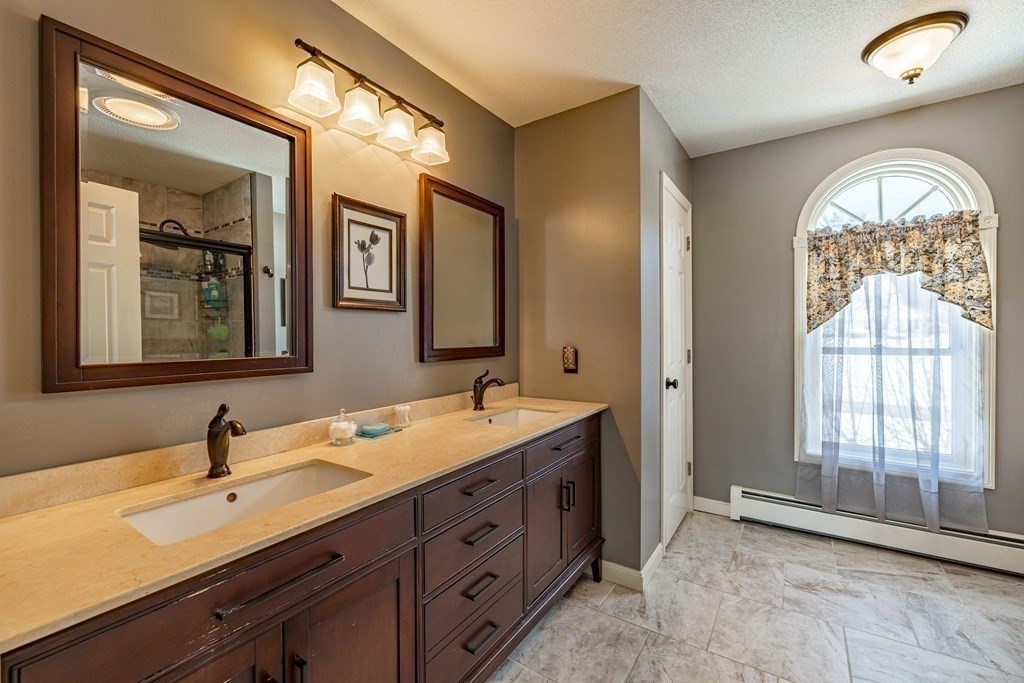 158 Scantic Road Hampden, MA 01036 - Photo 22 of 42 a spacious bathroom with a double vanity sink and a mirror