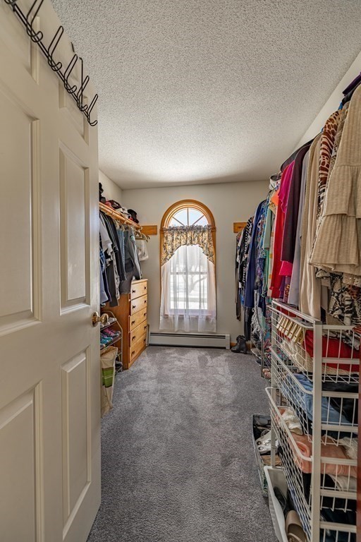 158 Scantic Road Hampden, MA 01036 - Photo 24 of 42 a view of walk in closet with clothes and shoes