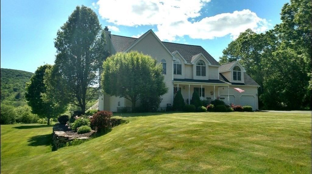 158 Scantic Road Hampden, MA 01036 - Photo 37 of 42 a front view of a house with a yard