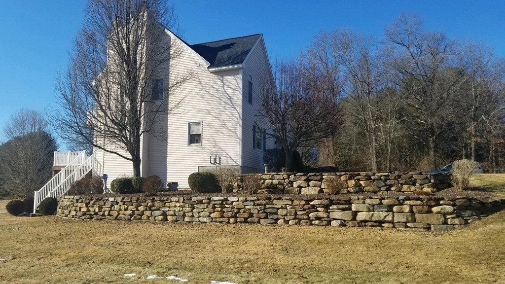 158 Scantic Road Hampden, MA 01036 - Photo 41 of 42 a front view of a house with a yard