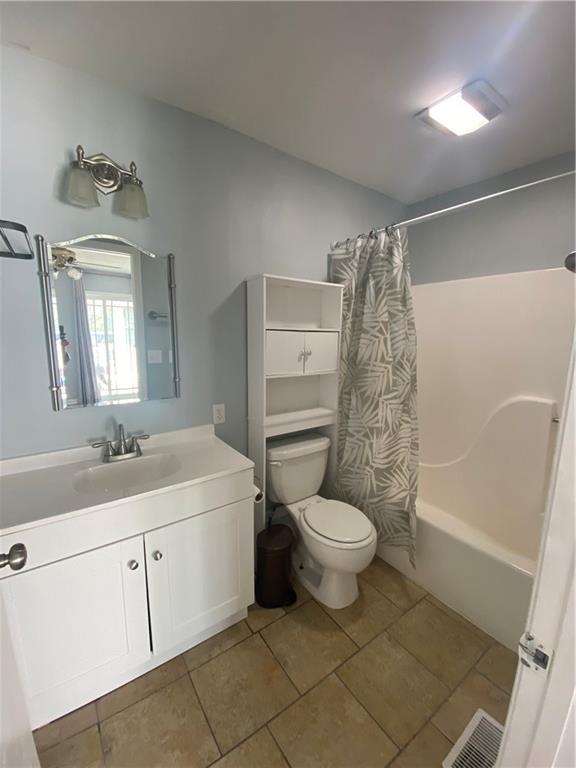64 Arnold Road Cartersville, GA 30120 - Photo 13 of 23 a bathroom with a sink a toilet and shower