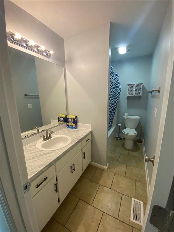64 Arnold Road Cartersville, GA 30120 - Photo 14 of 23 a spacious bathroom with a double vanity sink toilet and a mirror