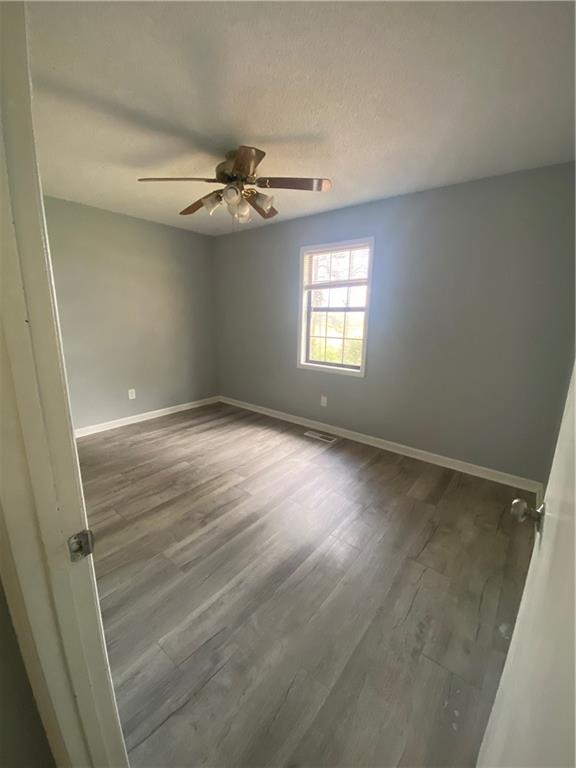 64 Arnold Road Cartersville, GA 30120 - Photo 16 of 23 an empty room with windows and fan