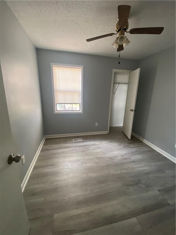 64 Arnold Road Cartersville, GA 30120 - Photo 18 of 23 a view of room with a ceiling fan and window