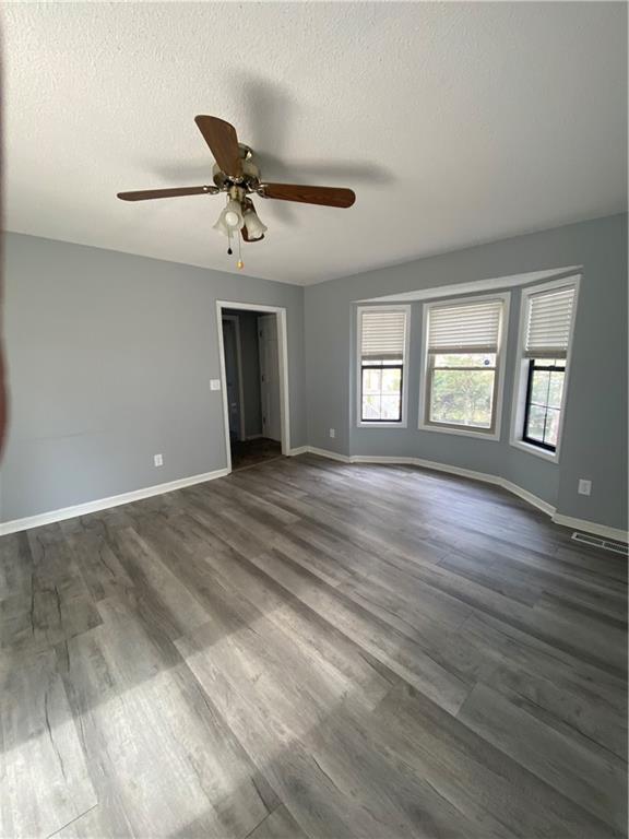 64 Arnold Road Cartersville, GA 30120 - Photo 19 of 23 a view of an empty room with wooden floor and a window