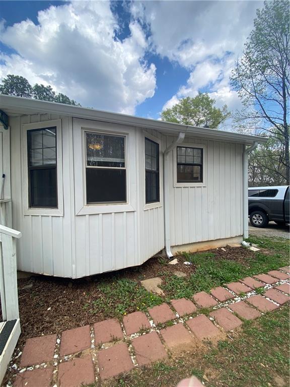 64 Arnold Road Cartersville, GA 30120 - Photo 20 of 23 a view of a house with a yard