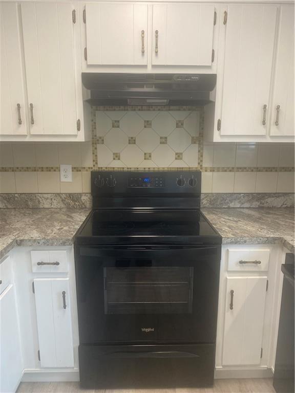 64 Arnold Road Cartersville, GA 30120 - Photo 4 of 23 a stove top oven sitting inside of a kitchen