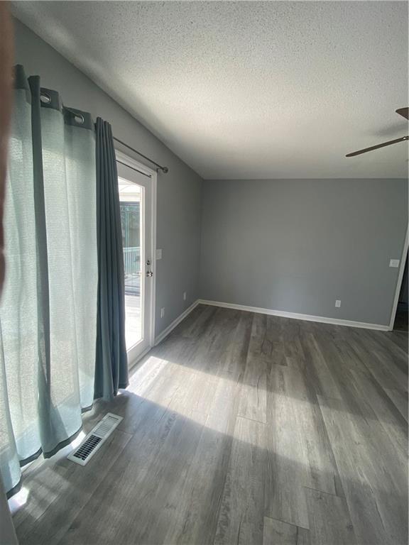 64 Arnold Road Cartersville, GA 30120 - Photo 8 of 23 an empty room with wooden floor and windows