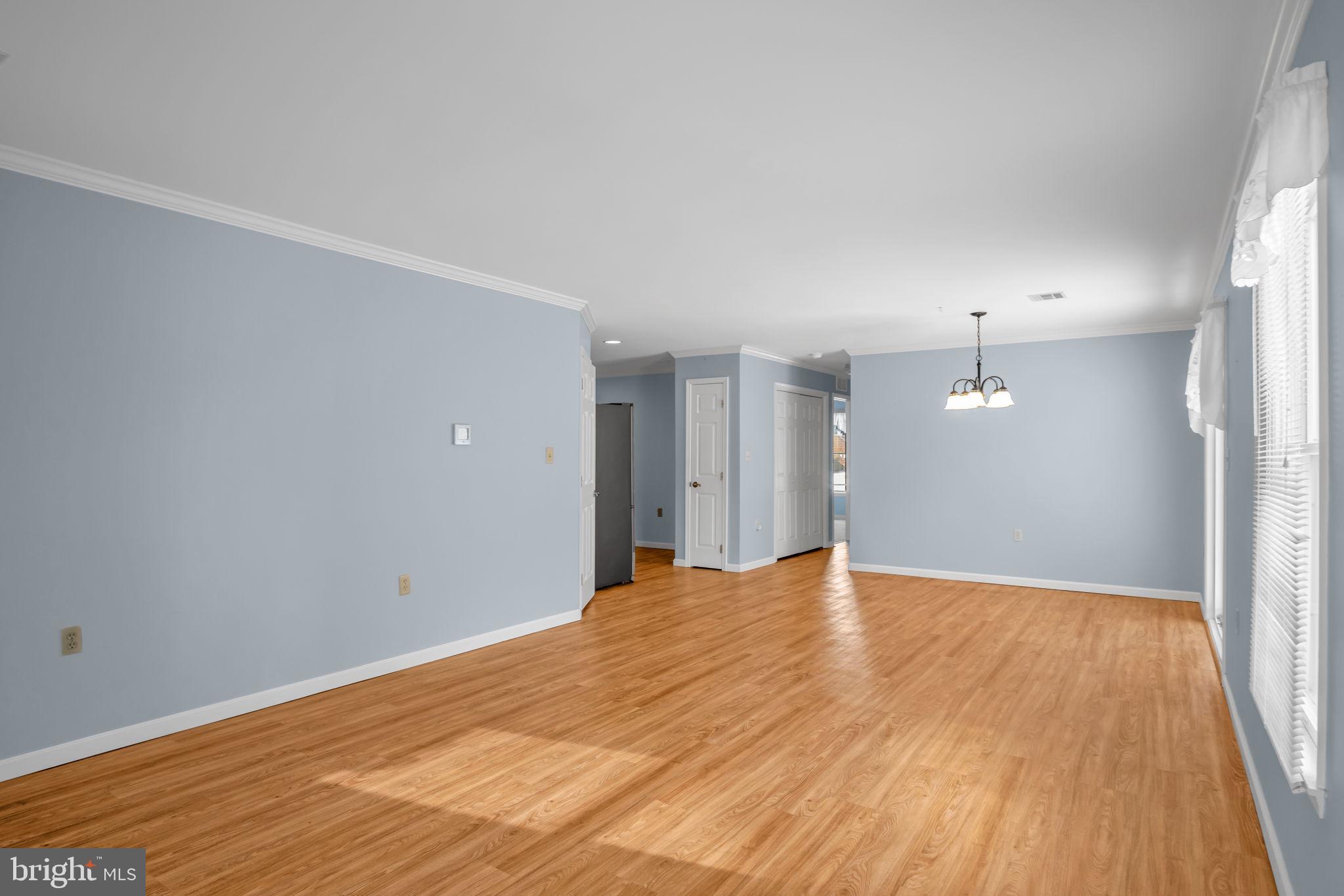 433 Mill Race Road Carlisle, PA 17013 - Photo 5 of 27 a view of an empty room with wooden floor