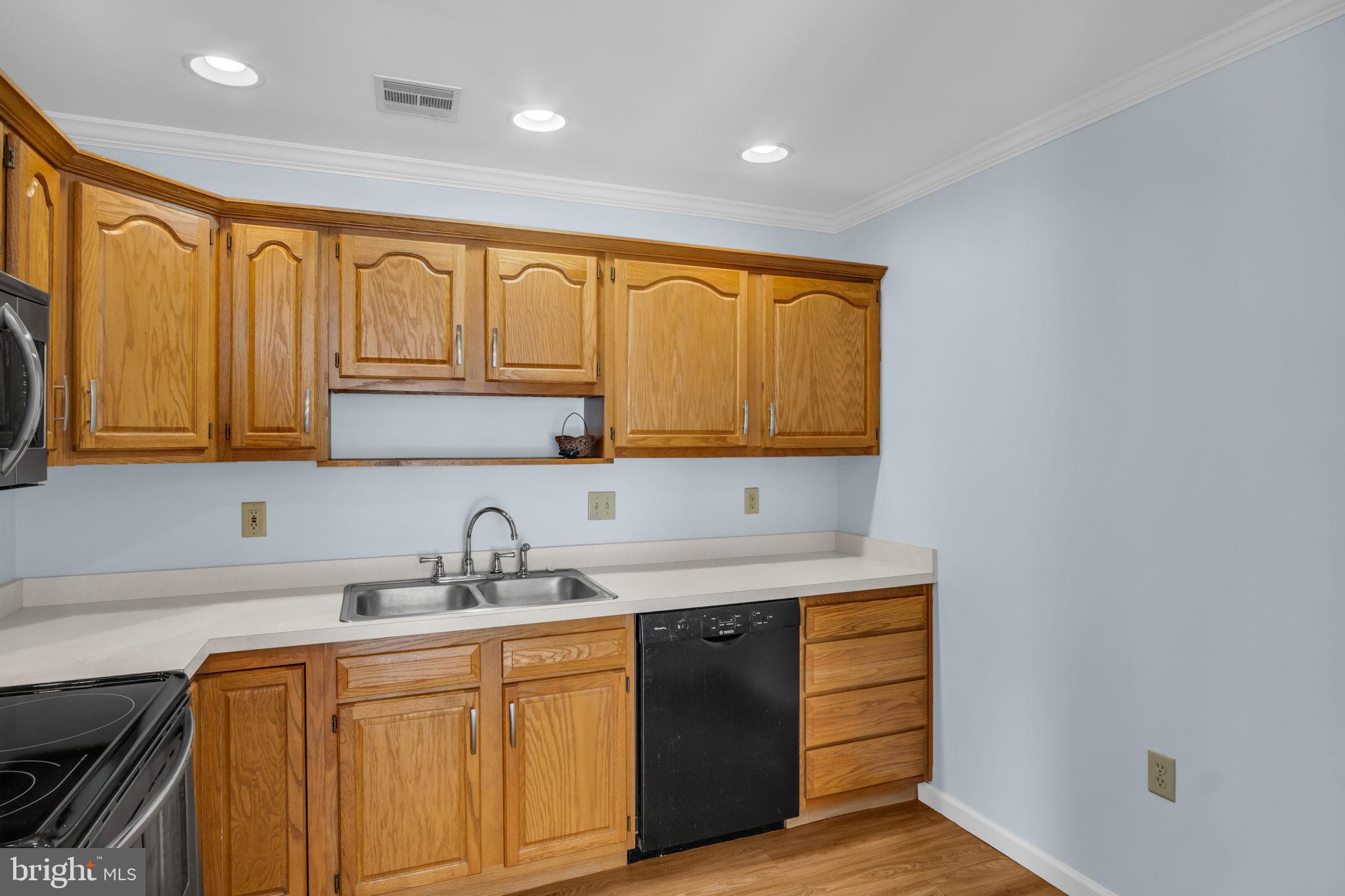 433 Mill Race Road Carlisle, PA 17013 - Photo 9 of 27 a kitchen with stainless steel appliances granite countertop a sink a stove and cabinets