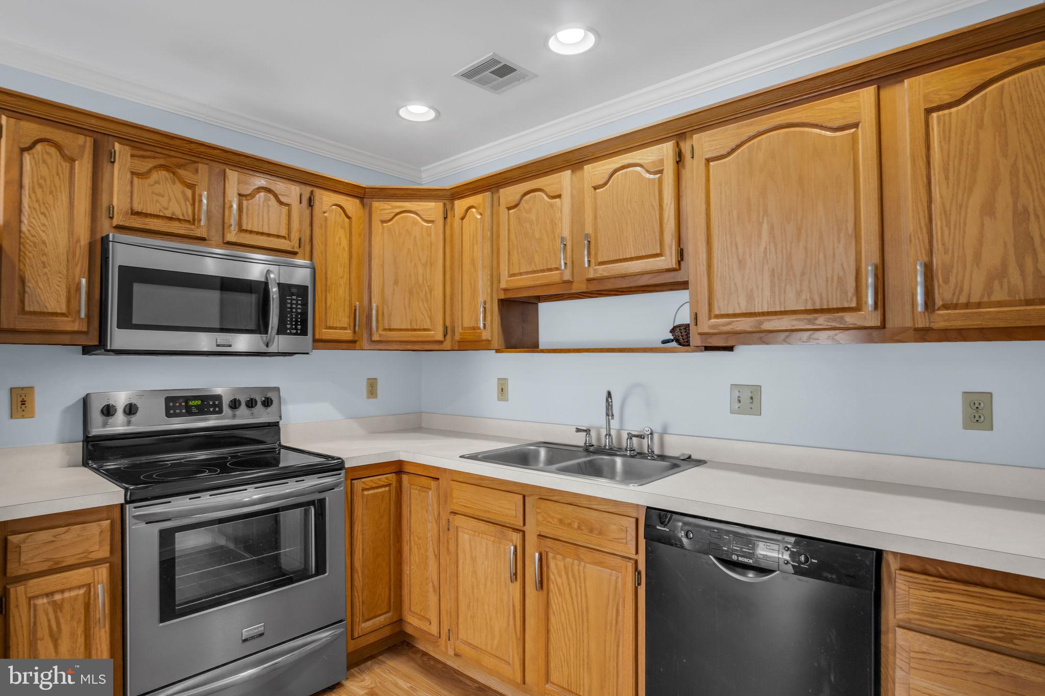 433 Mill Race Road Carlisle, PA 17013 - Photo 10 of 27 a kitchen with stainless steel appliances granite countertop white cabinets granite counter tops and a window