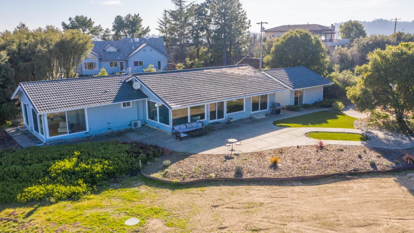 16984 Bohlman Road Saratoga, CA 95070 - Photo 1 of 50 a view of a house with a big yard and large trees