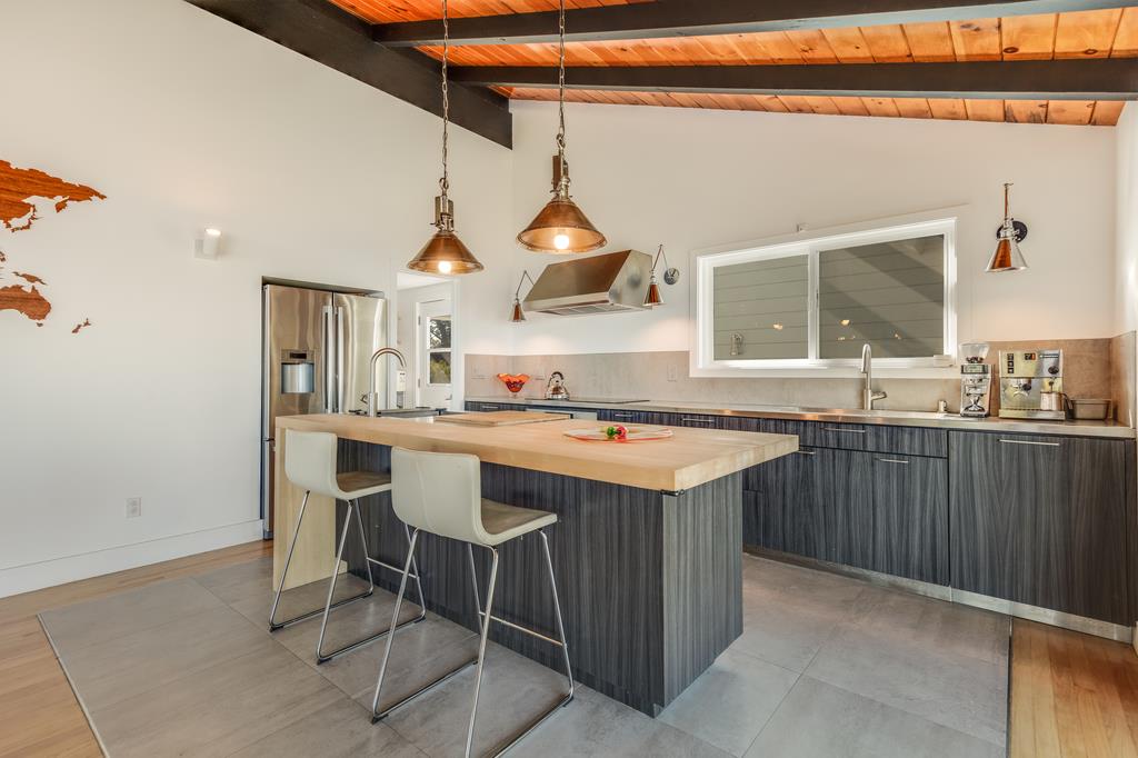 16984 Bohlman Road Saratoga, CA 95070 - Photo 16 of 50 a kitchen with a sink and chairs