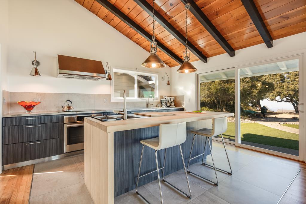 16984 Bohlman Road Saratoga, CA 95070 - Photo 17 of 50 a kitchen with stainless steel appliances granite countertop a sink a stove and a refrigerator