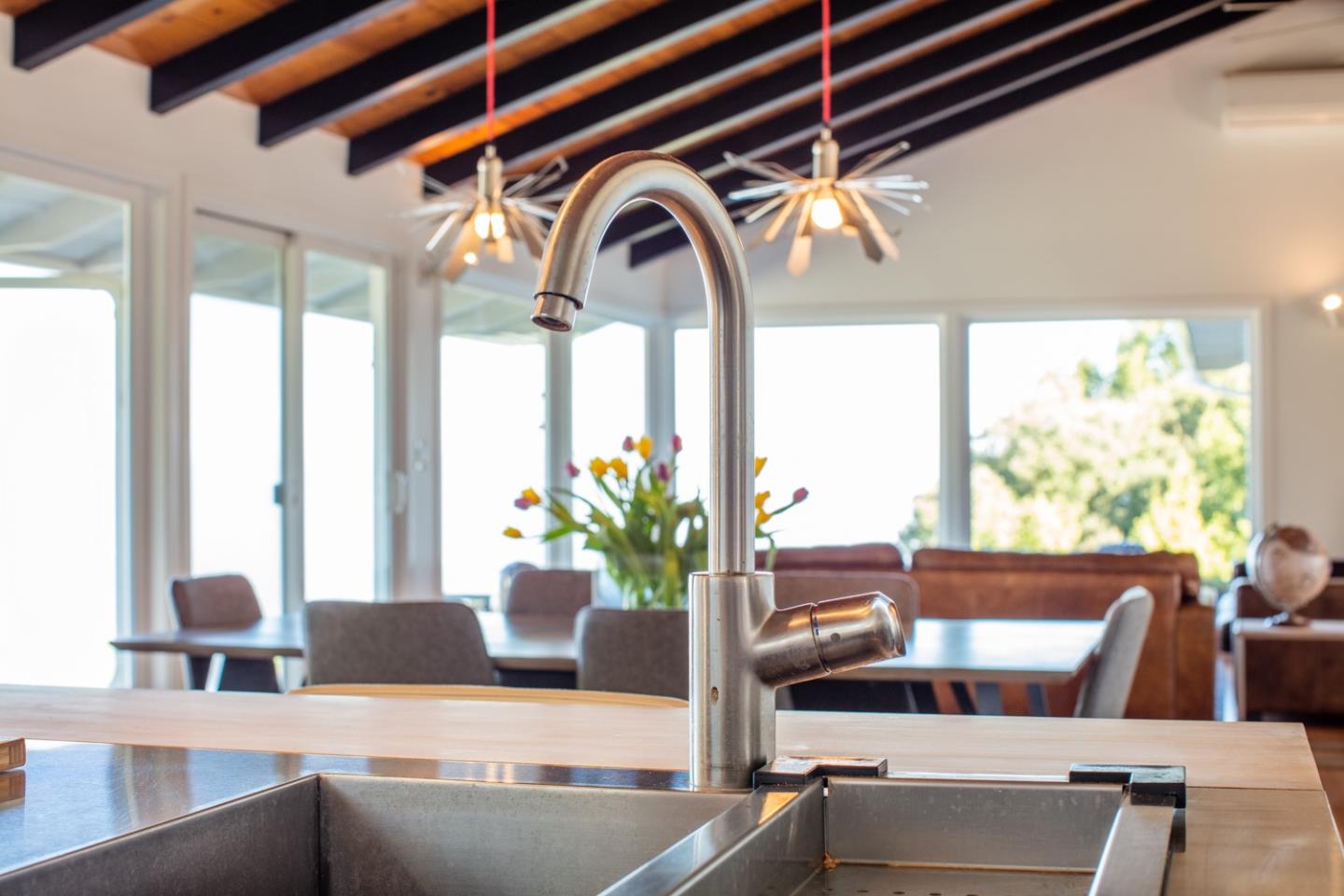 16984 Bohlman Road Saratoga, CA 95070 - Photo 24 of 50 a view of a living room with furniture and a potted plant