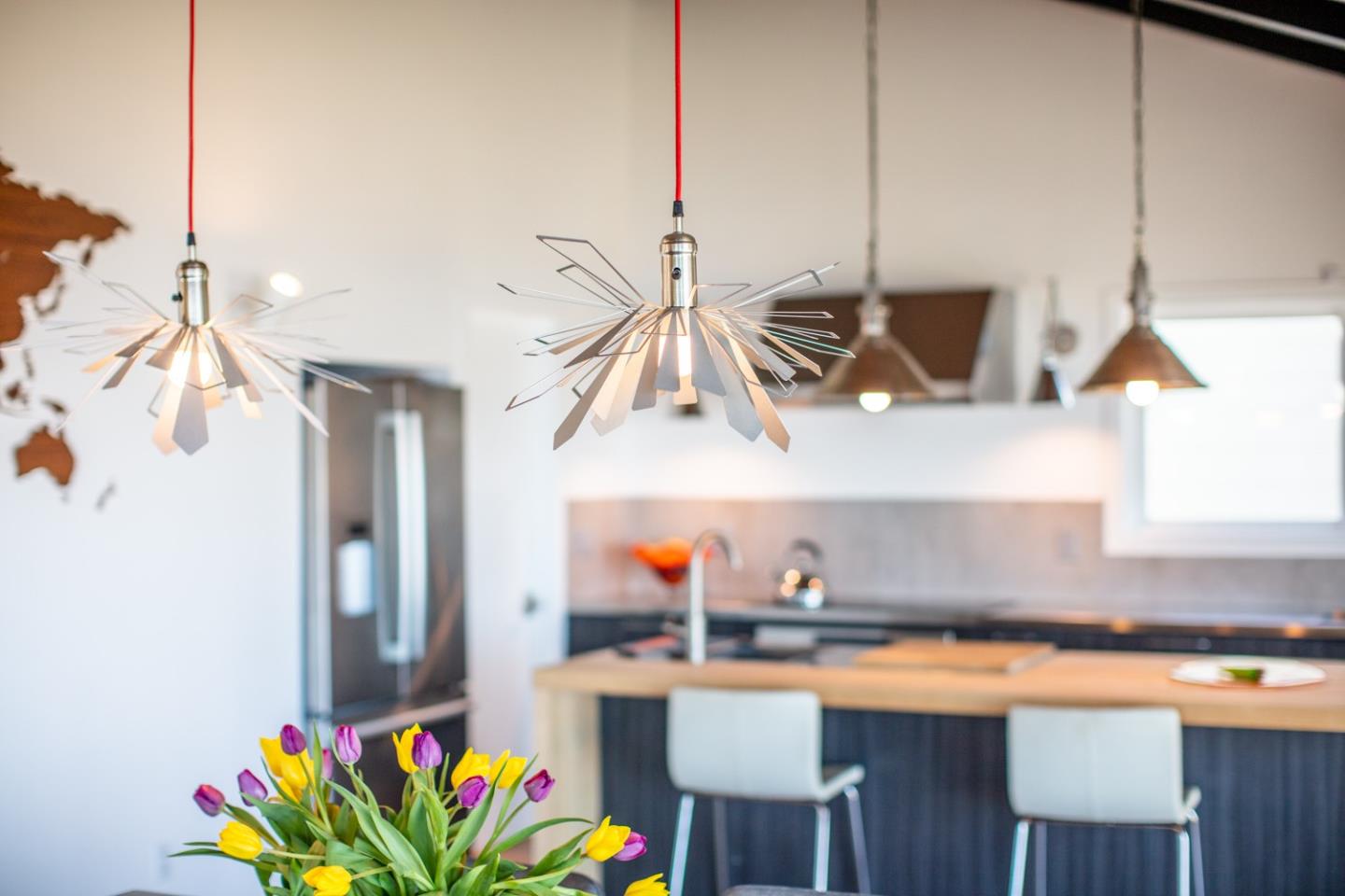 16984 Bohlman Road Saratoga, CA 95070 - Photo 27 of 50 a kitchen with stainless steel appliances granite countertop a sink a stove and a wooden floor