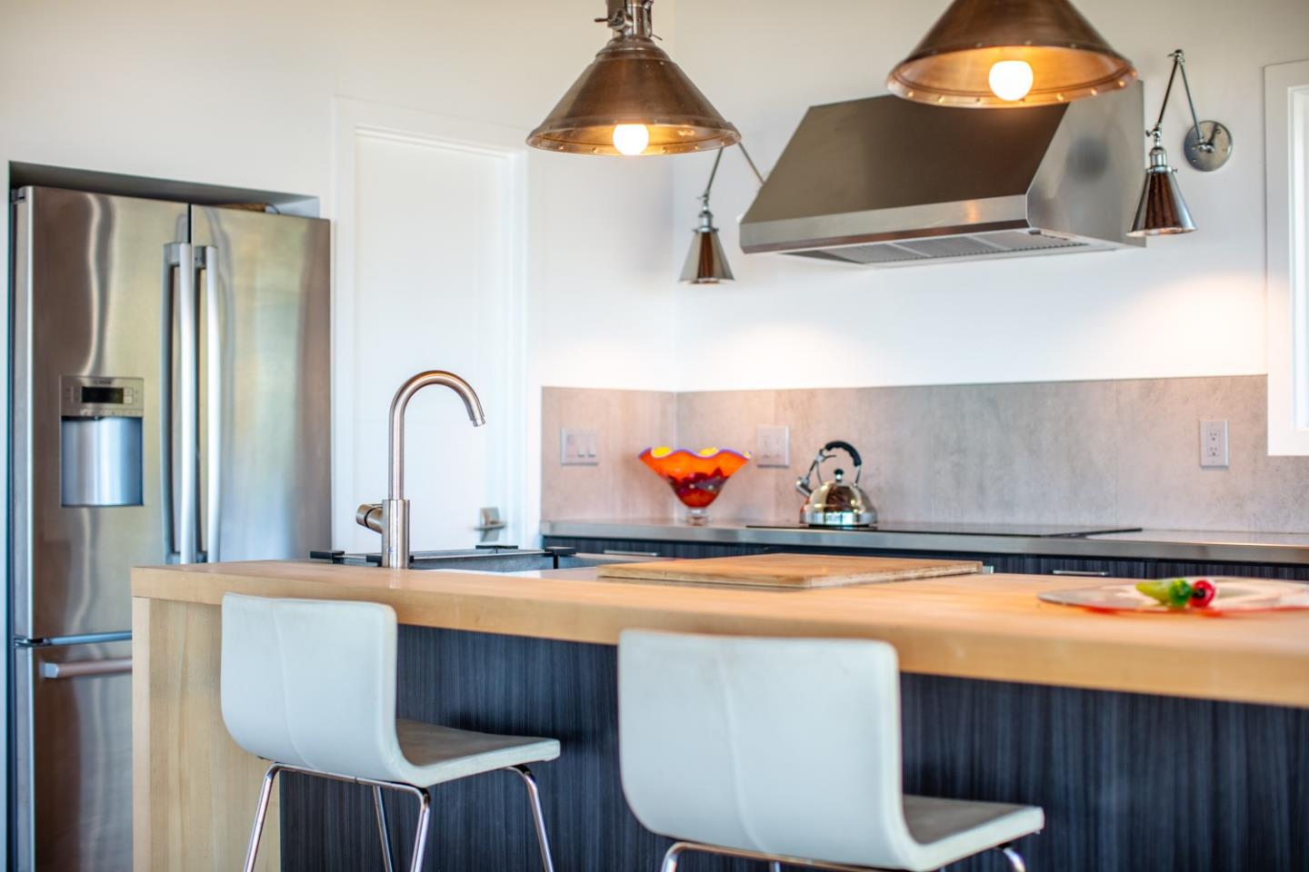 16984 Bohlman Road Saratoga, CA 95070 - Photo 28 of 50 a kitchen with a table and chairs