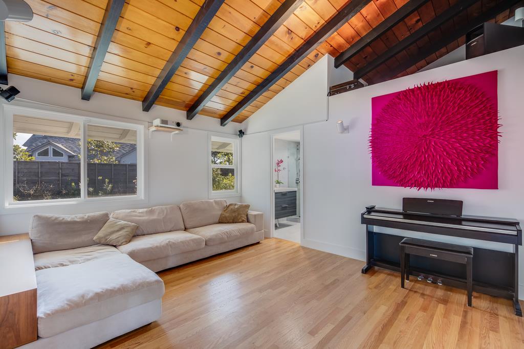 16984 Bohlman Road Saratoga, CA 95070 - Photo 29 of 50 a living room with furniture and a piano