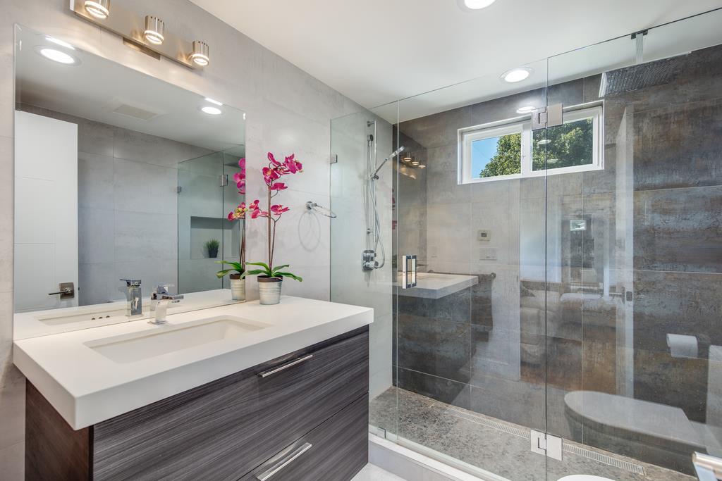 16984 Bohlman Road Saratoga, CA 95070 - Photo 30 of 50 a bathroom with a sink shower and a mirror