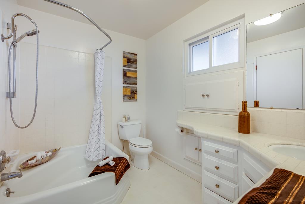 16984 Bohlman Road Saratoga, CA 95070 - Photo 34 of 50 a bathroom with a sink a toilet and a mirror