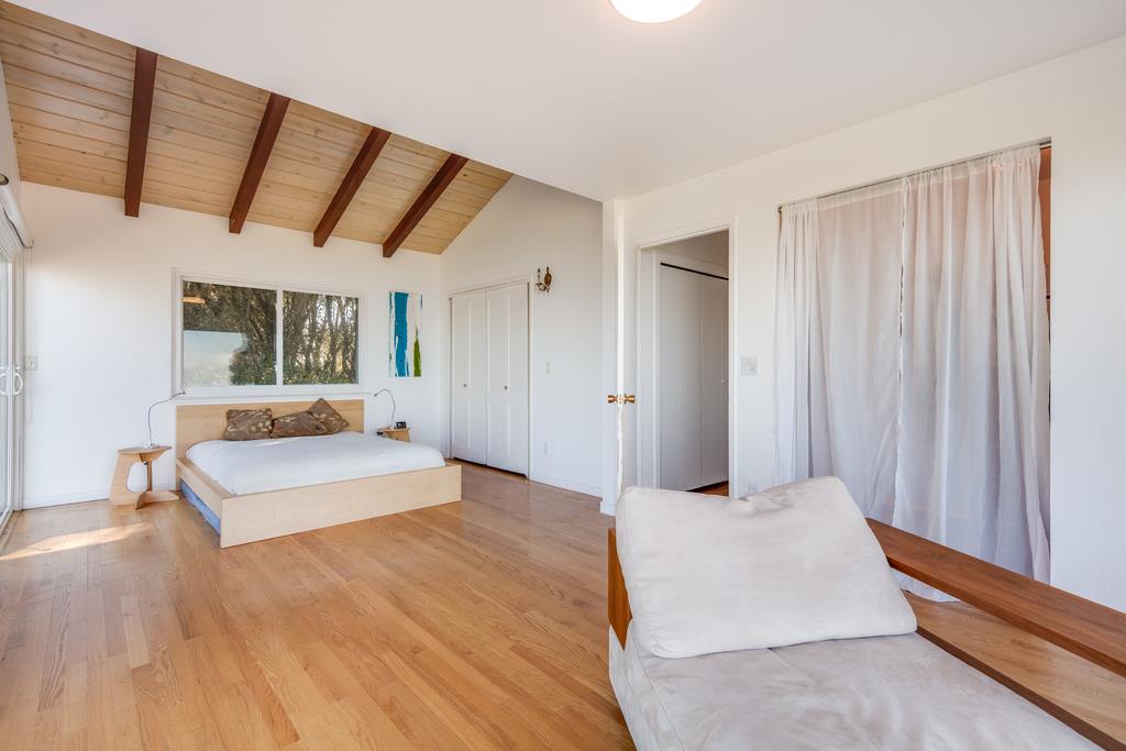 16984 Bohlman Road Saratoga, CA 95070 - Photo 37 of 50 a bedroom with a bed and a large window