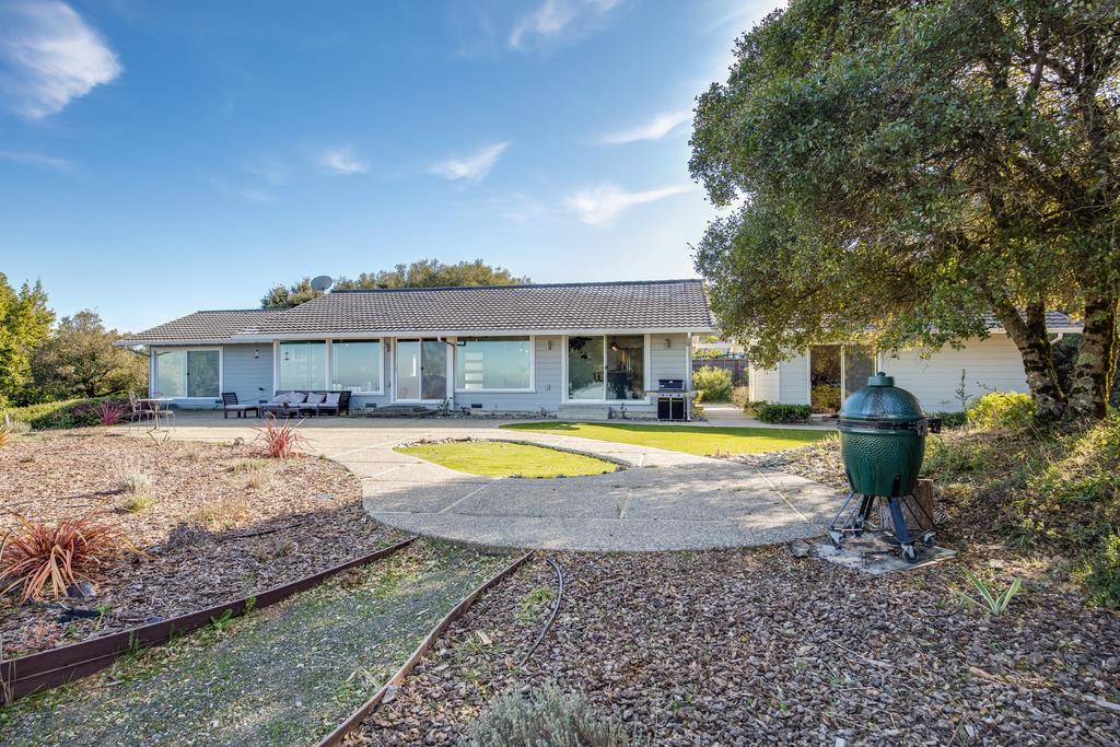 16984 Bohlman Road Saratoga, CA 95070 - Photo 45 of 50 a view of a house with swimming pool and a yard