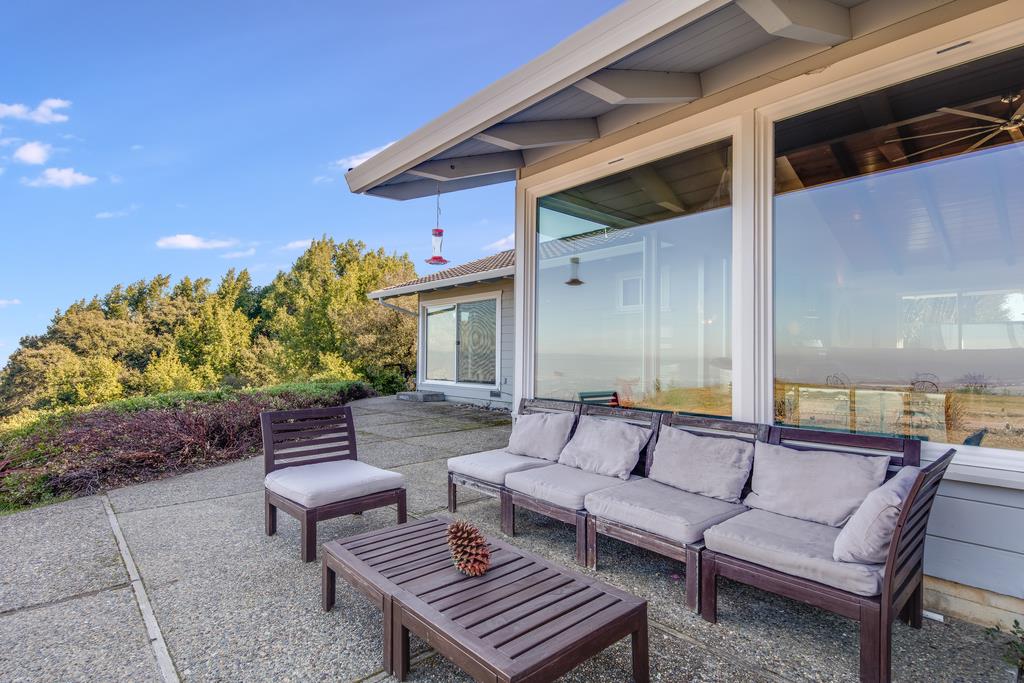 16984 Bohlman Road Saratoga, CA 95070 - Photo 48 of 50 a balcony with furniture and a potted plant