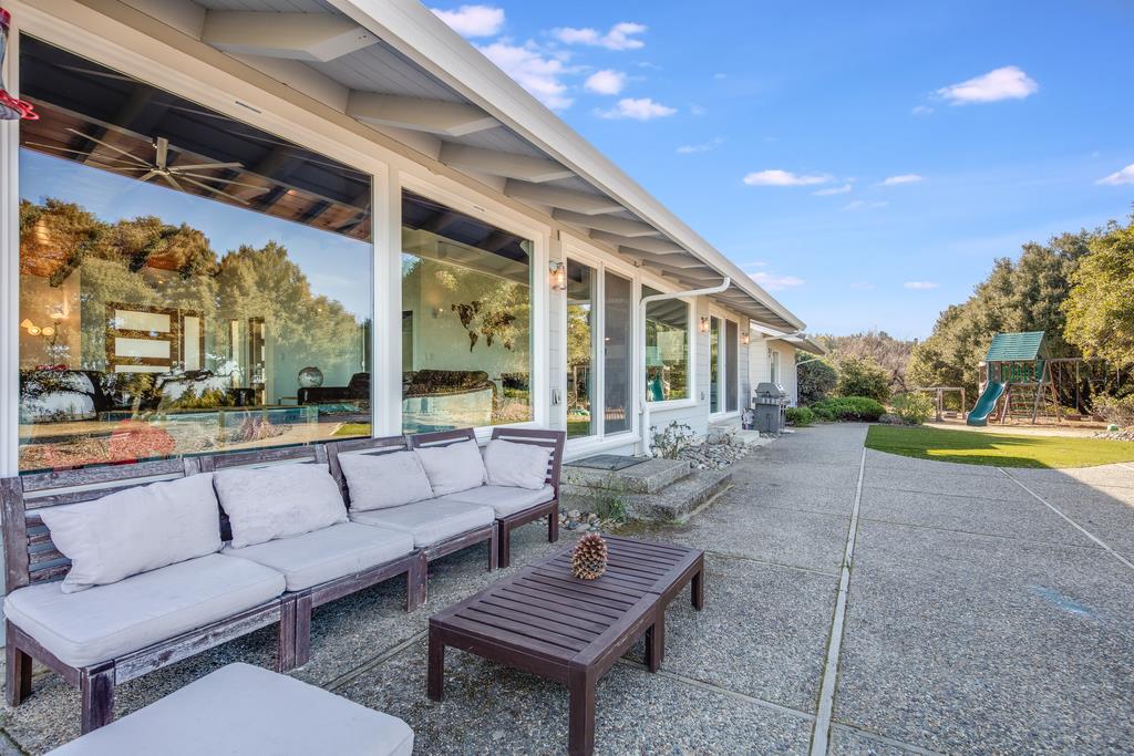 16984 Bohlman Road Saratoga, CA 95070 - Photo 49 of 50 a outdoor space with patio the couches and pool chair with potted plants