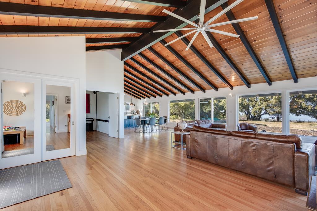 16984 Bohlman Road Saratoga, CA 95070 - Photo 5 of 50 a view of living room with furniture and floor to ceiling window