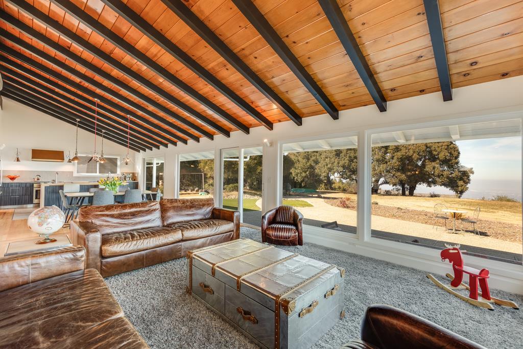 16984 Bohlman Road Saratoga, CA 95070 - Photo 7 of 50 a living room with furniture and a floor to ceiling window