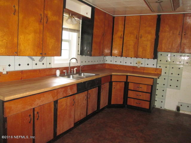 6252 Firestone Road Jacksonville, FL 32244 - Photo 5 of 12 a bathroom with a sink and a mirror