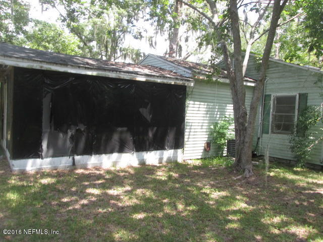 6252 Firestone Road Jacksonville, FL 32244 - Photo 10 of 12 a view of tree in front of a house