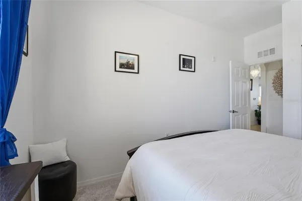 a bathroom with a sink a toilet and a large mirror