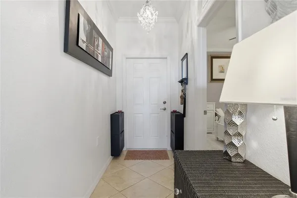 a balcony with wooden floor table and chair