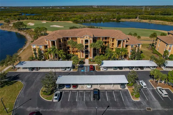 a backyard of a house with barbeque oven table and chairs
