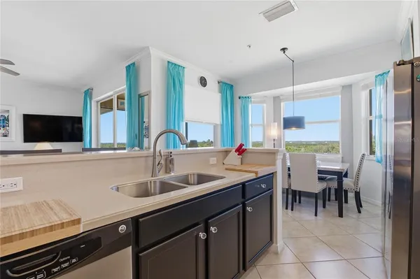 a kitchen with stainless steel appliances wooden cabinets and a stove top oven