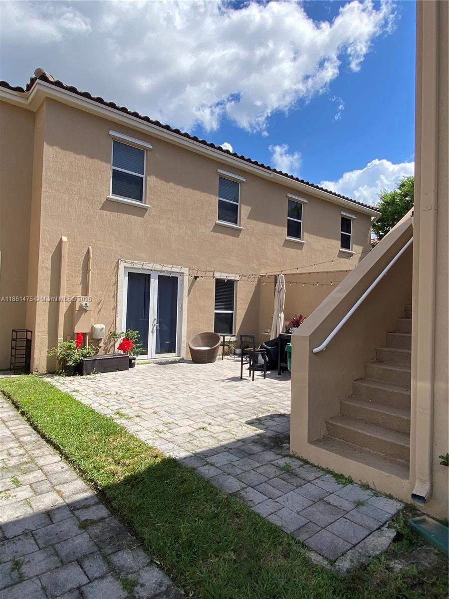 17004 Southwest 95th Terrace Miami, FL 33196 - Photo 11 of 15 a view of a house with backyard and sitting area