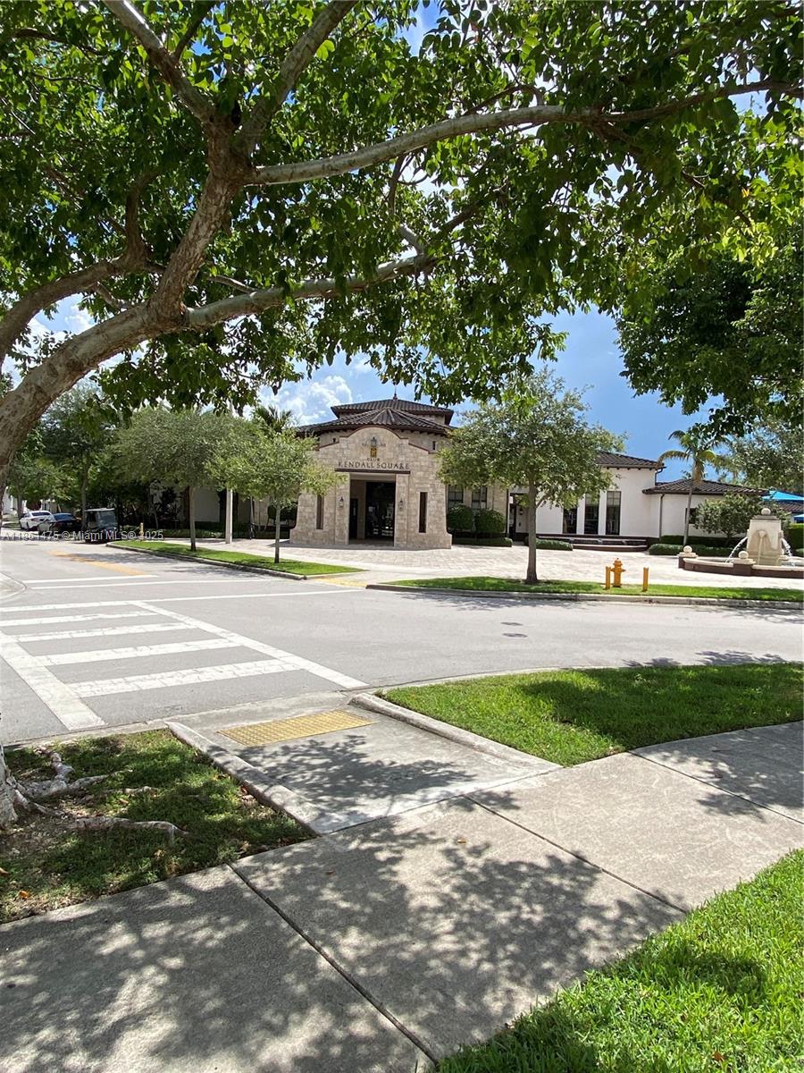17004 Southwest 95th Terrace Miami, FL 33196 - Photo 13 of 15 a building with trees in front of it