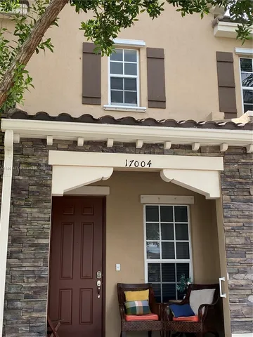 a front view of a house with a garage