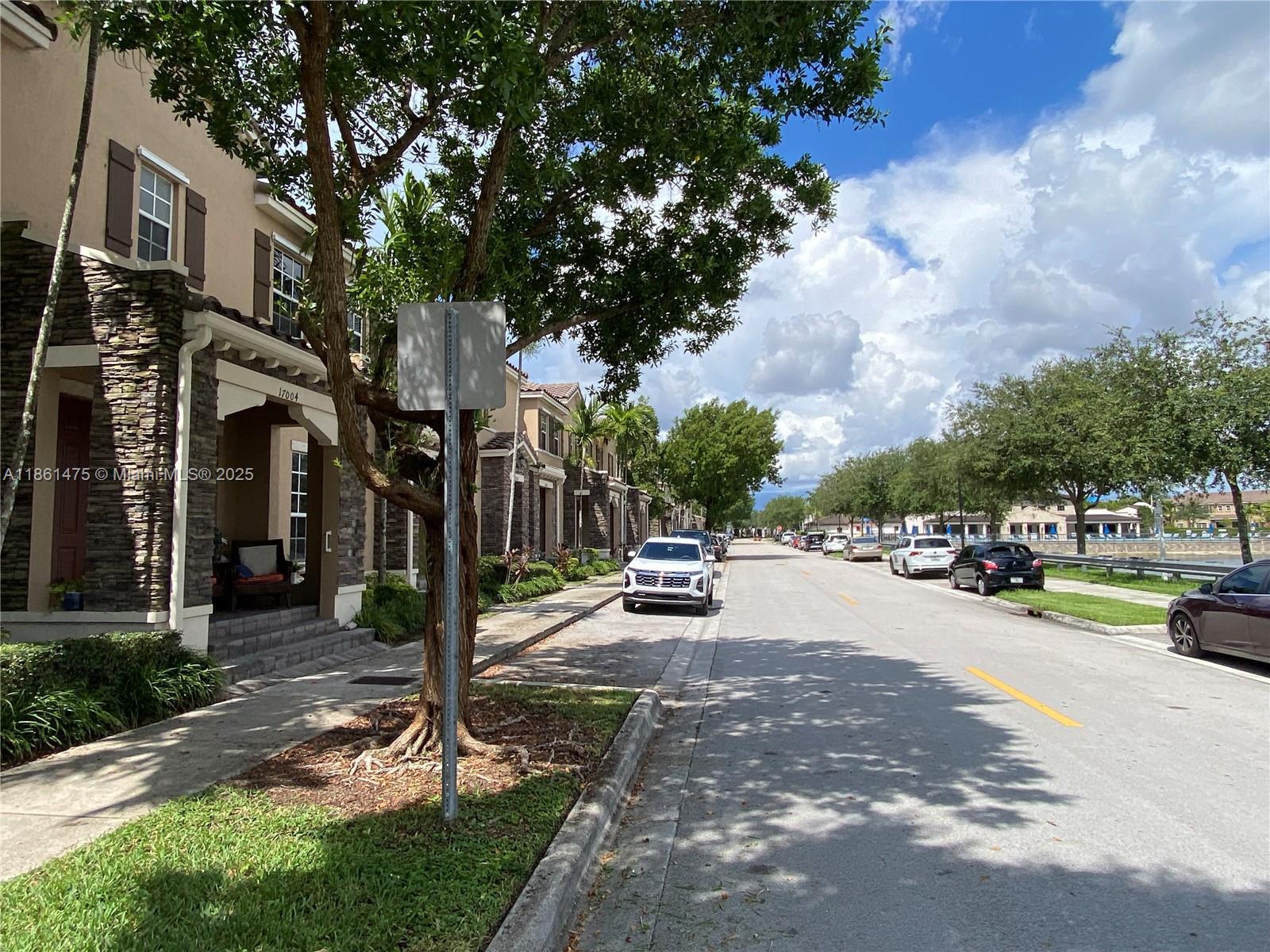 17004 Southwest 95th Terrace Miami, FL 33196 - Photo 4 of 15 a view of a park with swings and slides