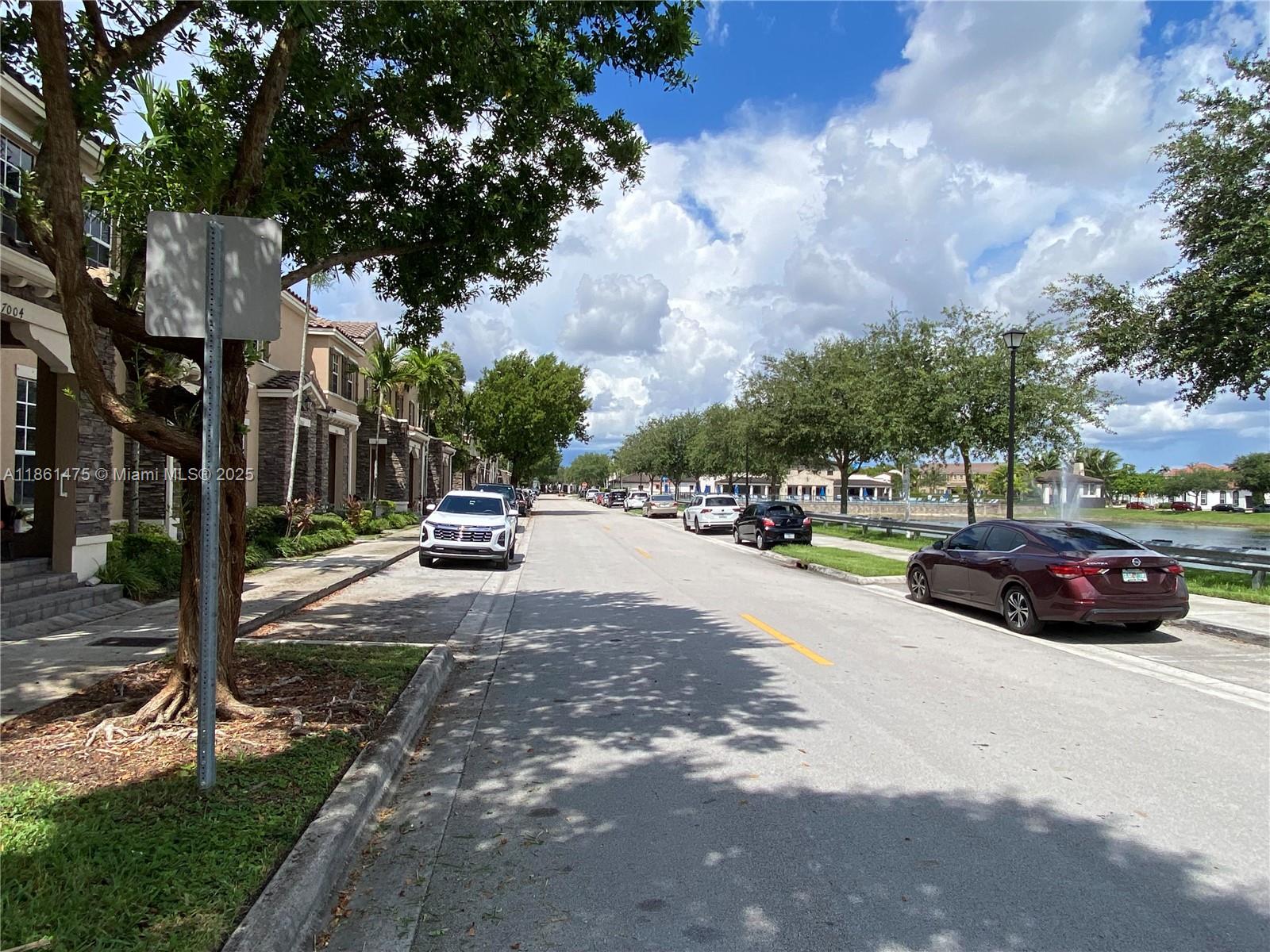 17004 Southwest 95th Terrace Miami, FL 33196 - Photo 5 of 15 a car parked on the side of the road