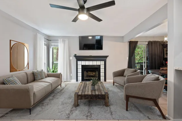 a living room with furniture and a fireplace
