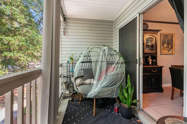 a view of a house with potted plants