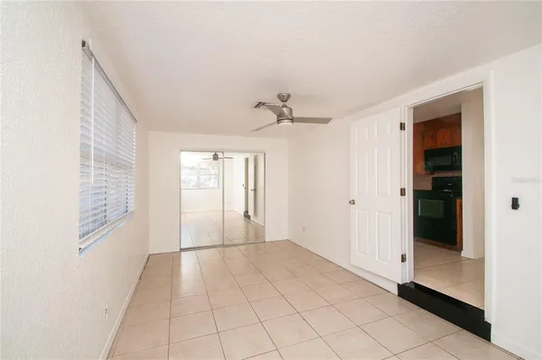 a view of an empty room and window