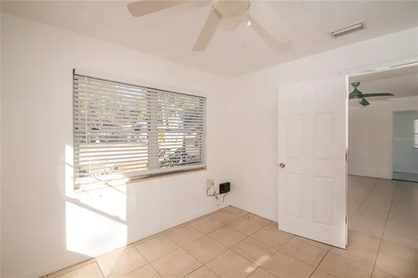 a view of an empty room with a window