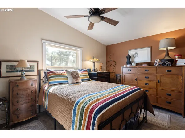 a bedroom with a bed and a dresser
