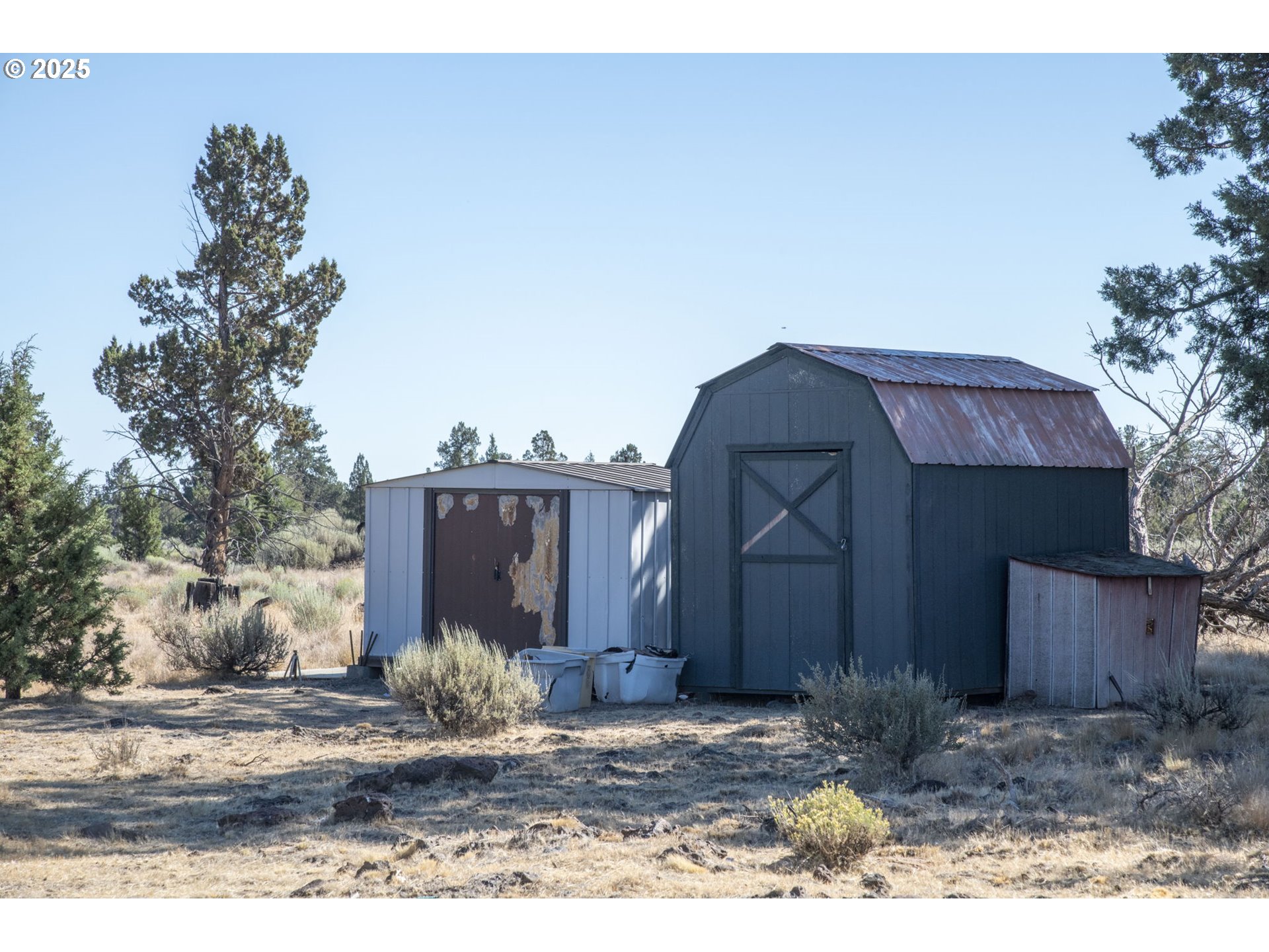 12510 Southwest Geneva Road Culver, OR 97734 - Photo 21 of 47 a view of a house with a yard and large tree