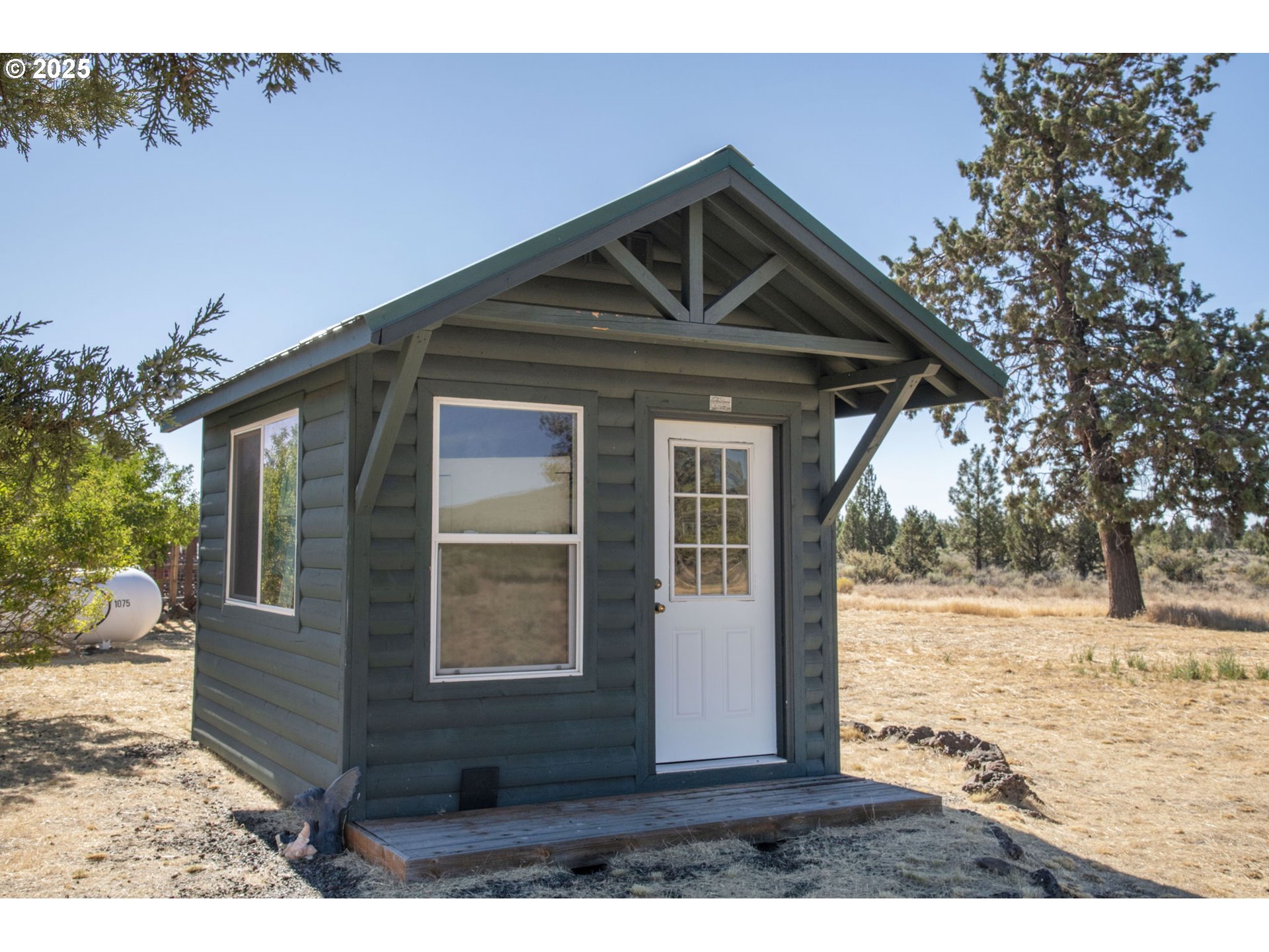 12510 Southwest Geneva Road Culver, OR 97734 - Photo 22 of 47 a front view of a house with a yard